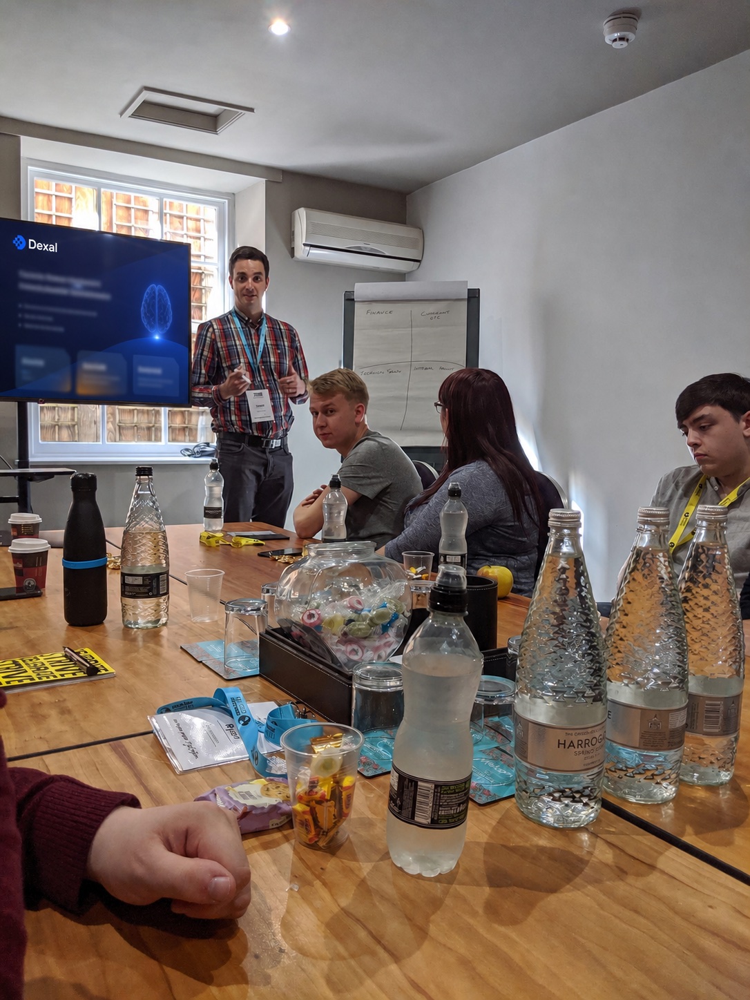 Daniel Nicolson leading a workshop session with a Dexal presentation on screen